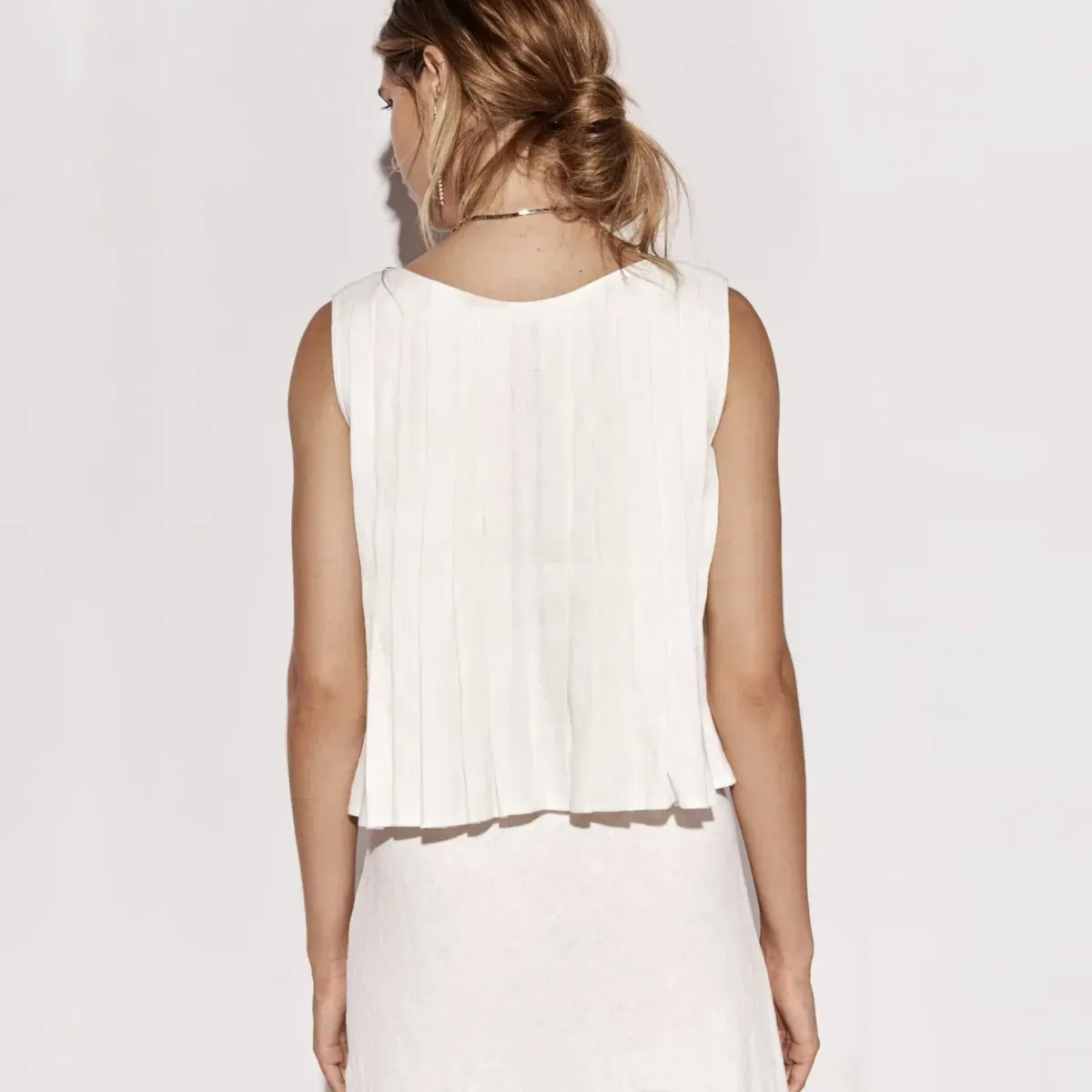 Poise Tie-Front Sleeveless Ruffle Hem Top